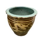 A large earthenware planter with brown exterior glaze and turquoise inside