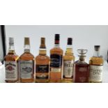 A collection of spirits to include Dewers, Jim Beam, Southern Comfort, and others 7 bottles