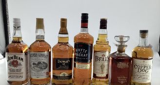 A collection of spirits to include Dewers, Jim Beam, Southern Comfort, and others 7 bottles