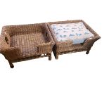 Two wicker work dog baskets, raised on 4 feet, one with cushion