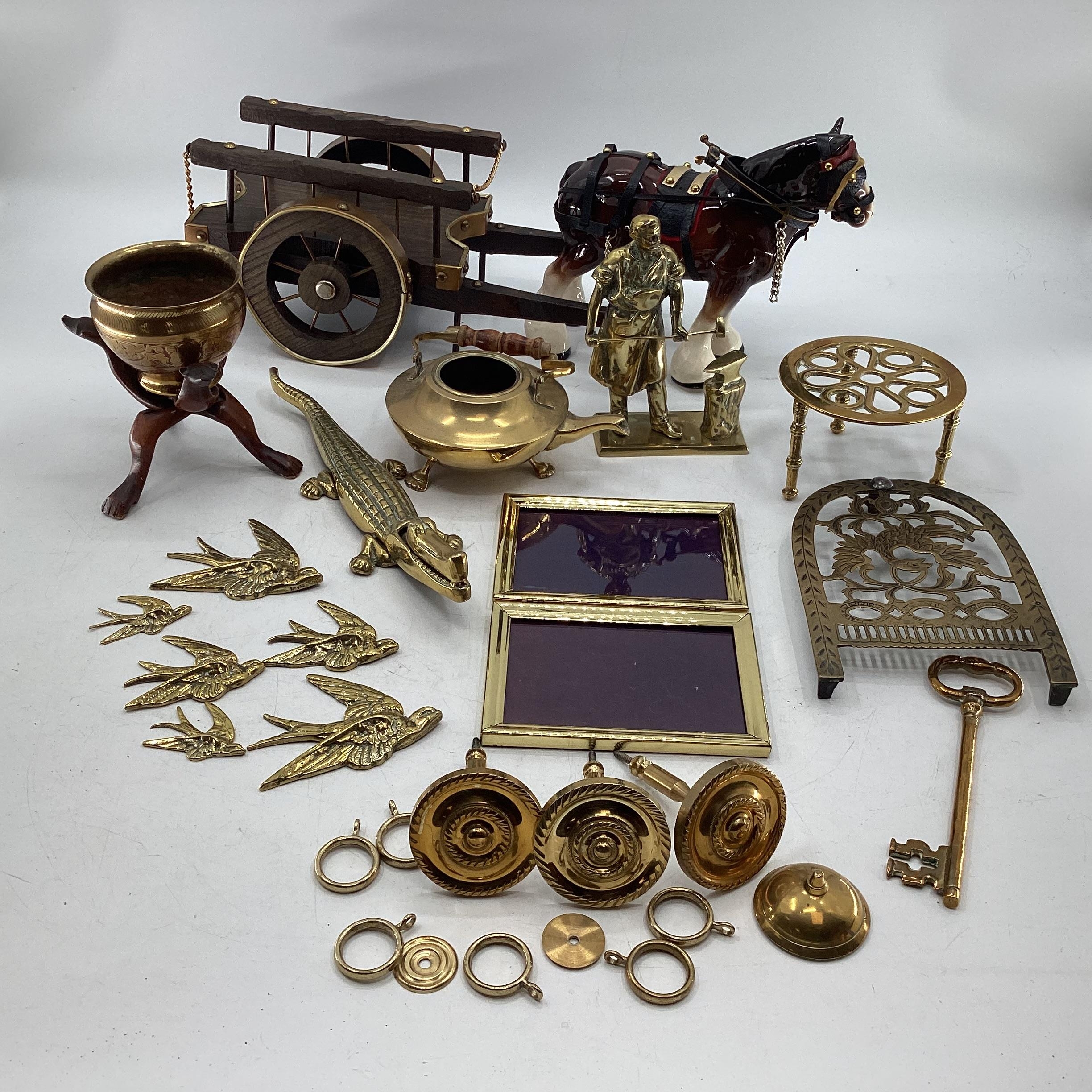 A collection of brass items together with a Beswick style horse and cart.