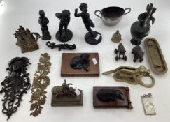 A mixed collection of metalware to include a pair of bronze putto, a bronze Oriental stylised dragon