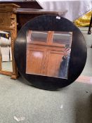 A modern circular wall mirror