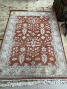 Rug: Persian style, with terracotta ground and beige borders, 237cmLong x 176cmW, stain at one