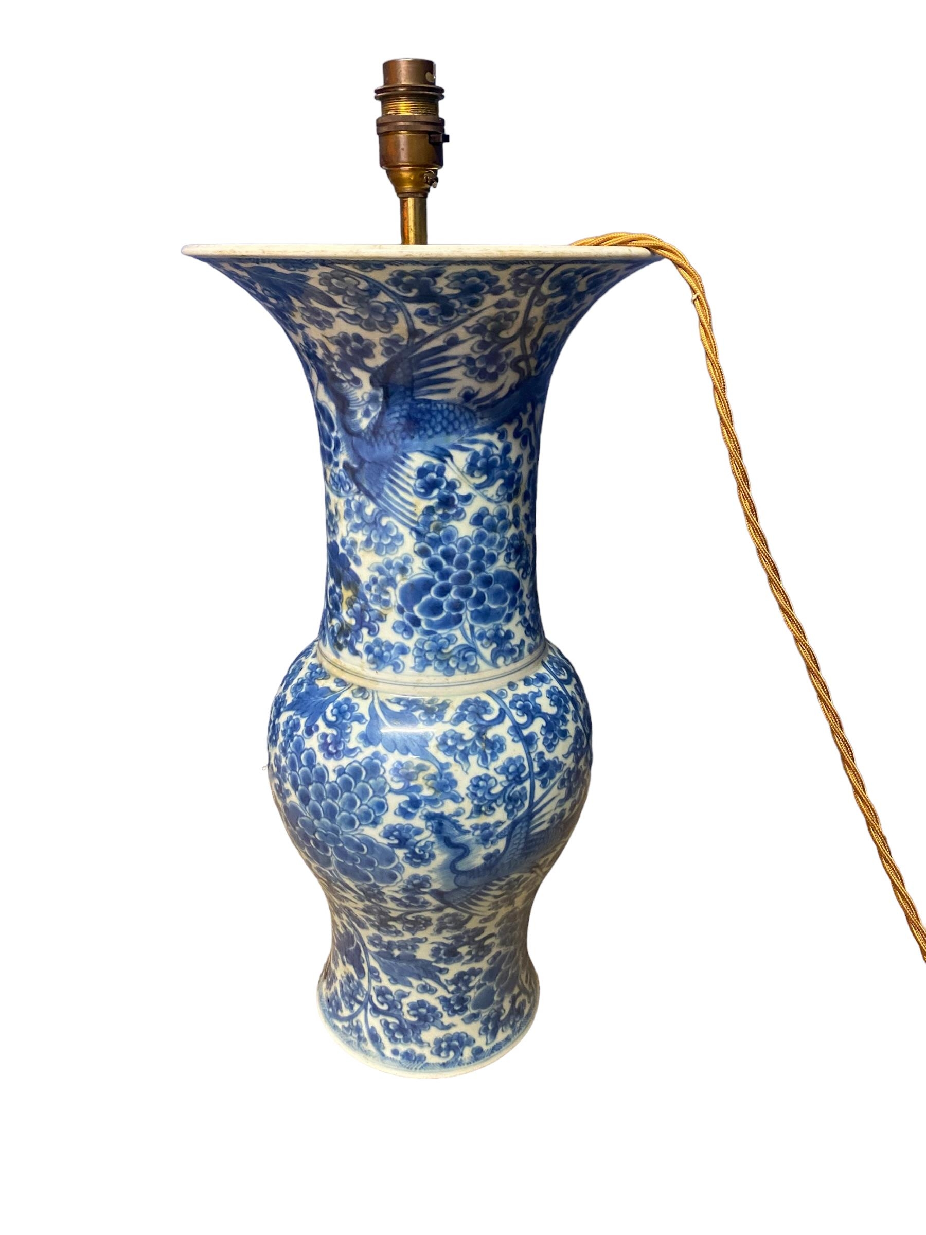 A blue and white Chinese style ceramic lamp, with brass light fitting, not drilled to base, some