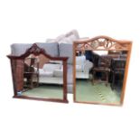 Two large wooden mirrors, the first large wooden framed wall mirror, with scrolling arched frieze to