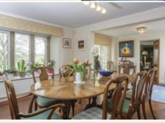A good quality Queen Anne style walnut dining suite comprising a triple pedestal D End extending