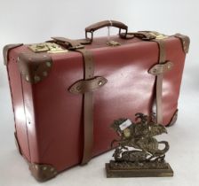 A Globe Trotter Vintage suitcase, a brass door stop and a wall mirror
