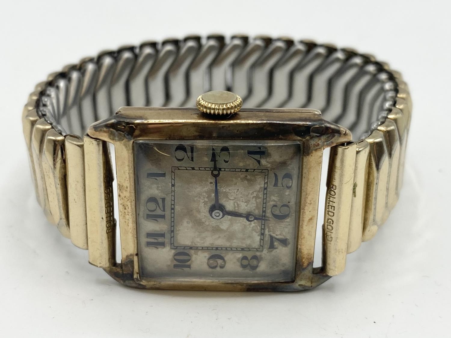 A 9ct gold cased gents watch, rectangular case with Roman numeral markers, on rolled gold strap, - Image 2 of 5