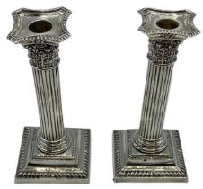 A pair of sterling silver weighted column candlesticks 160 cm H