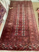 Persian style rug, red ground, with tears and losses 130cm x 295cm]