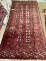 Persian style rug, red ground, with tears and losses 130cm x 295cm]