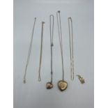 A collection of 9ct gold items to include two heart lockets(one back and front example)