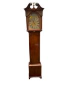 A mahogany long case clock, the silvered and brass arched dial with black Roman numerals,