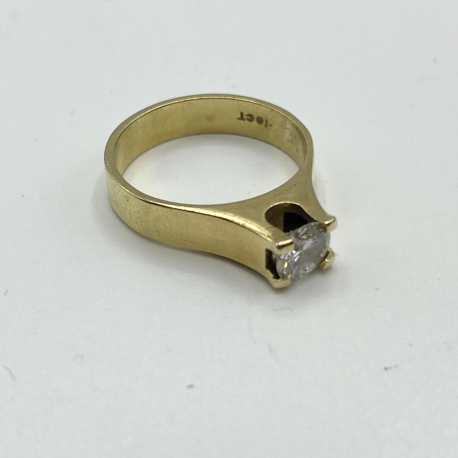 An 18ct gold single stone diamond ring, 6mm brilliant cut diamond in a rub over setting. Size L 4.8g - Image 2 of 3