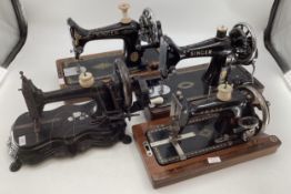 Four vintage sewing machines, to include Singer and Vesta with boxes