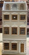 A vintage dolls house, fitted interior, some furniture, 85 x 42cm (missing roof)