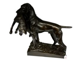 FRITZ DILLER(1875-1945). A Bronze model of a hunting dog and fox.