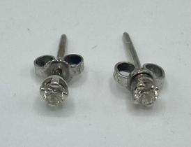 A pair of 9 ct white gold and diamond ear studs