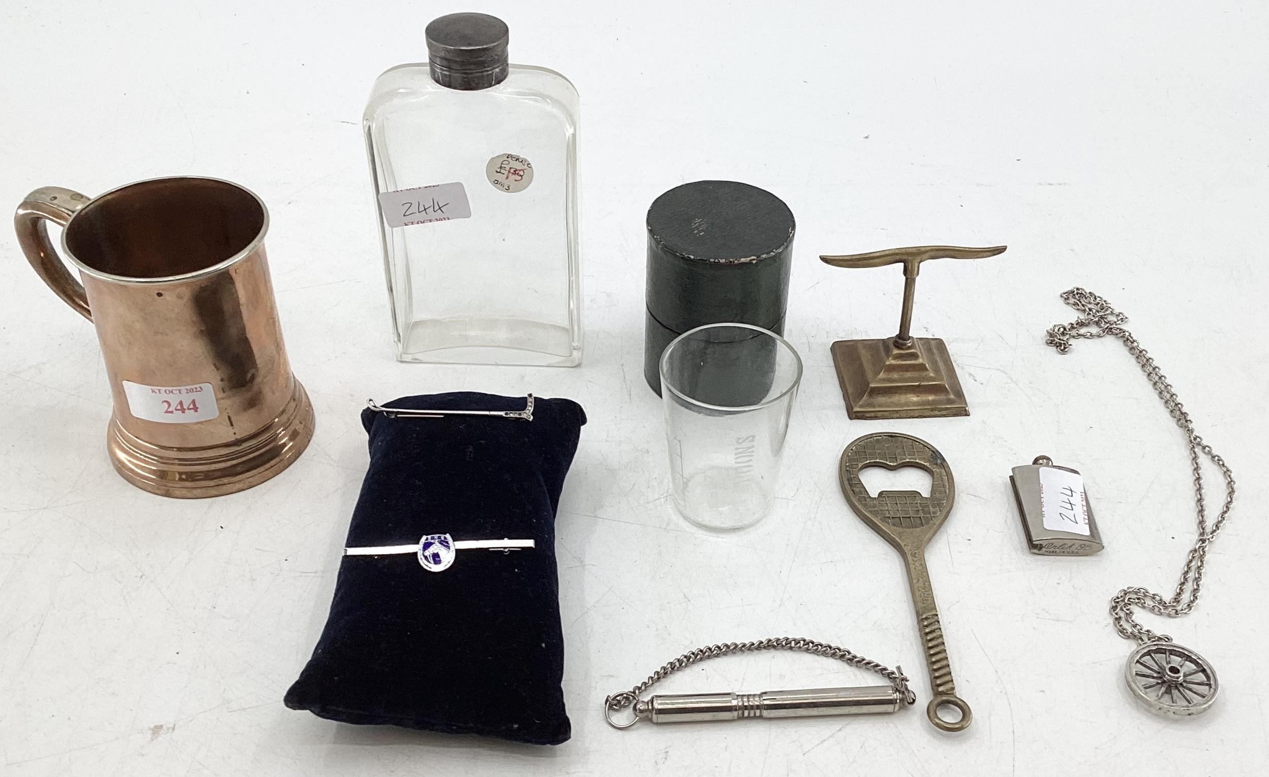 Glass bottle , tennis racket bottle opener, copper tankard, two stock pins, lighter marked 1915 USA,