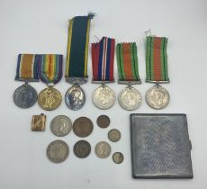 A sterling silver cigarette case together with WWI medals to Capt EF Davis, WWII medals and