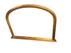 A gilt frame arched over mantle wall mirror, 96cm Wide