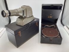 An HMV portable gramophone together with a mid C20th projector