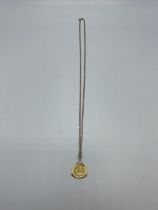 A 9 ct gold flat link necklace together with a bezel set 1/10th oz Kruger and pendant 9.78 g