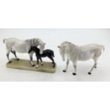A Beswick model of a dapple grey mare and bay foal on an oblong base ; together with a Beswick