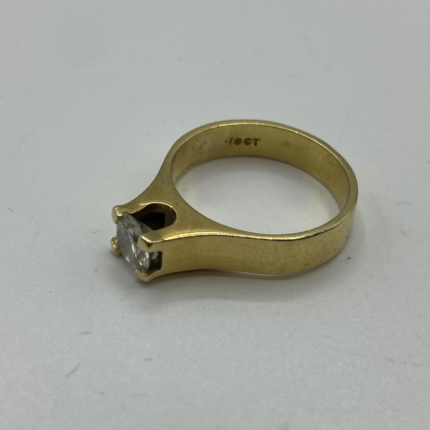 An 18ct gold single stone diamond ring, 6mm brilliant cut diamond in a rub over setting. Size L 4.8g - Image 3 of 3