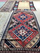 Three rugs: Beige ground Kilim rug with square pattern multi colour border 250cm x 176cm; a red