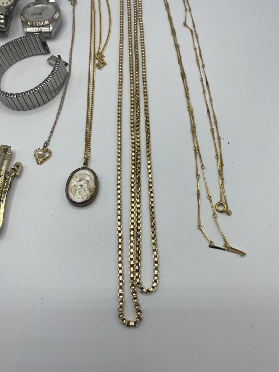 A collection of unmarked yellow metal jewellery together with some high street fashion watches. - Image 3 of 5