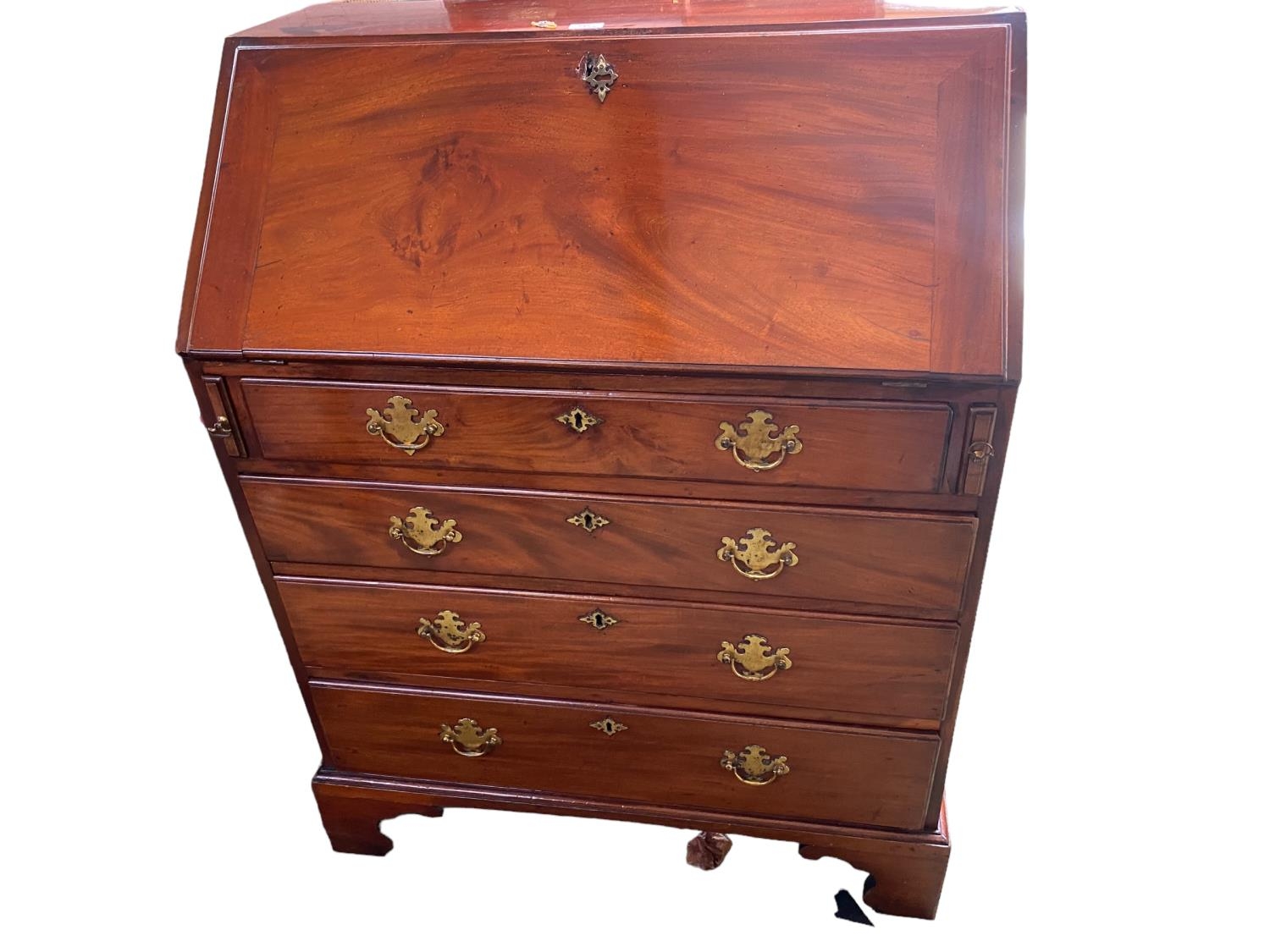 George III Mahogany Bureau with four graduated drawers, brass handles, key for bureau is present