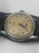 A vintage smith's deluxe 15 Jewel gents wristwatch 34mm case , currently running