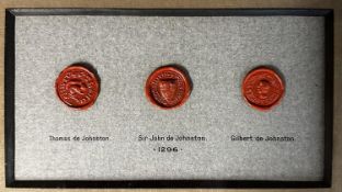 Three wax seals relating to the Scottish De Johnston Family in a glazed frame