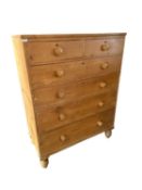 A large pine chest of 2 short over 4 long drawers with knob handles 107 W x 140cmH