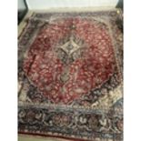 Large Tabriz rug, overall red ground with blue boarders, multi stylized