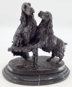 A bronze model of a pair of spaniels, indistinct etched signature, possibly Aaure, on an oval marble