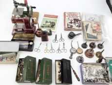 Two vintage miniature sewing machines, Vulcan Senior, Grain, together with sewing related tools,