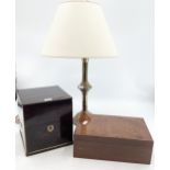 A coromandel and brass four section decanter box in burr walnut humidor and a brass table lamp