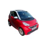 CAR: registration: LO63 RLY A red convertible automatic smart car, from a local deceased estate.