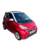 CAR: registration: LO63 RLY A red convertible automatic smart car, from a local deceased estate.