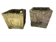 A matched pair of weathered stone square planters, 46cmH x 46diam, chips, and one cracked , see