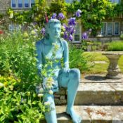 Joanna Wood, A life style cast bronze model of a seated lady holding a book, overall length 127cm x