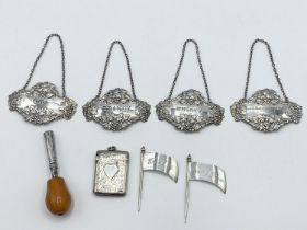 A collection of sterling silver items, to include decanter labels, cheese flags, vesta, and a