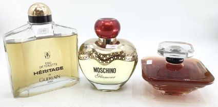 Three shop display perfume Factice bottles, Moschino, Guerlain and one other, largest 28 cm