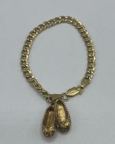 A 9ct gold bracelet and slipper charm 9.5g