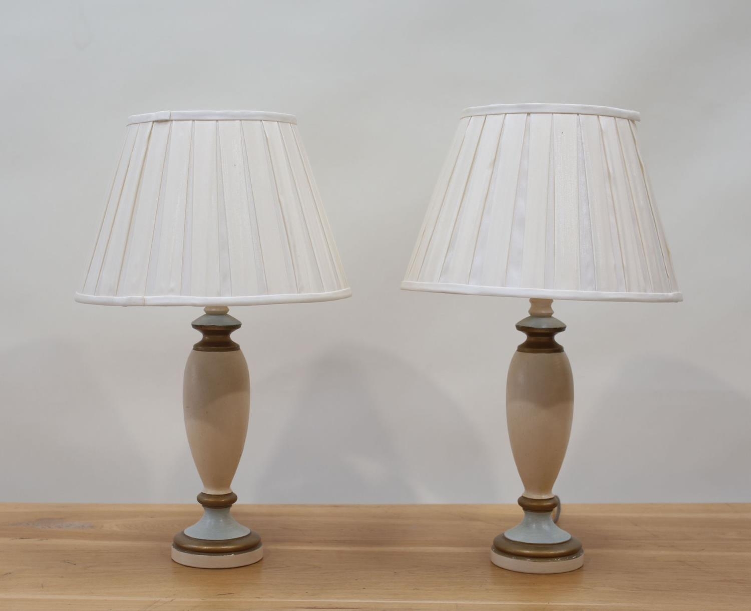 A Pair of Art Deco style table lamps and cream pleated shades