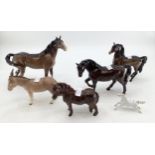 A collection of Beswick Horses, together with a Beswick Donkey and a small Blanc De Chine model of a