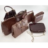 A quantity of brown leather vintage ladies handbags, and two leather briefcases